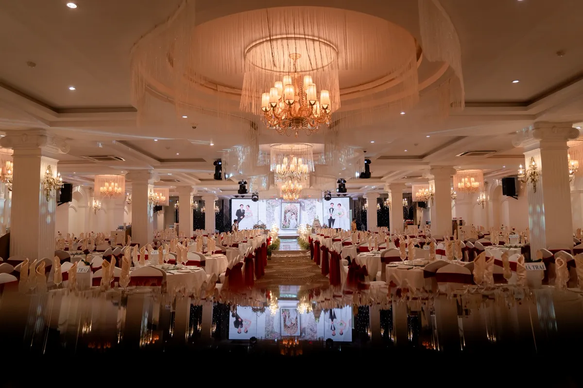 Award ceremony stage in a grand ballroom under dramatic lighting